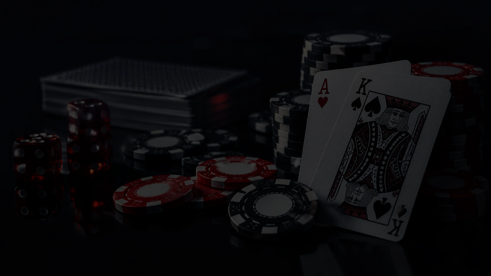 Dark poker scene with ace king cards dice and stacks of casino chips on black table